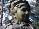 Moss and degradation attack the sculpture of Julia Morris Bentley.