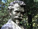 The heavily weathered face of Benjamin Whitehead begins to lose the detailed surface carving.