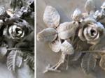 Before and during photos of the flowers carved on the base of the Bentley memorial. Note that the restorer is careful not to over clean, because removing the deeply penetrated stain could also result in removing or damaging some of the marble. A restrained touch is essential.
