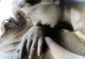 marble sculpture of a woman mourning